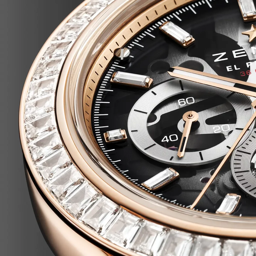 Gros plan sur les diamants de la lunette, l'index serti et le compteur de petite seconde à 9h de la montre Zenith Chronomaster Sport Skeleton en or.